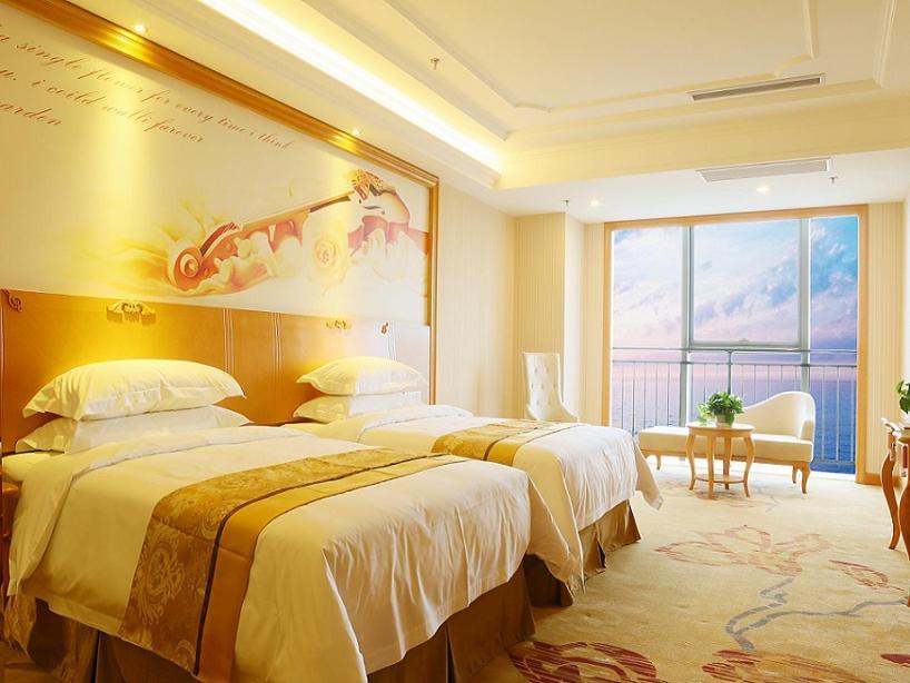 Vienna International Hotel Yantai Changjiang Road Xingyi Square Branch Esterno foto